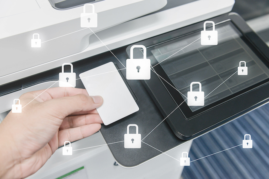 Business man hand is using smart card to printing document with locked key icon for data protection, printer security concept